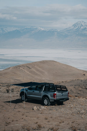 ROAM Adventure Co. Rooftop Awning in black shown on a Ford Ranger